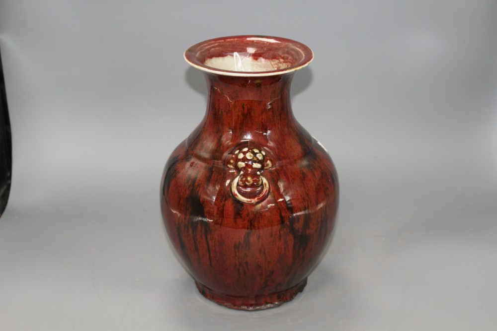 A Chinese flambe vase, with lion mask ring handles to the shoulder, H. 28.5cm